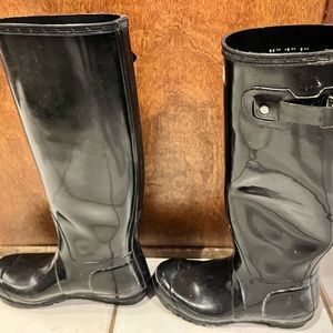 Hunter Gloss black rain boots. Showing some age as they have been stored.